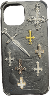 a phone case with a cross and other items on it