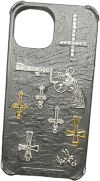 a phone case with a gun and crosses on it