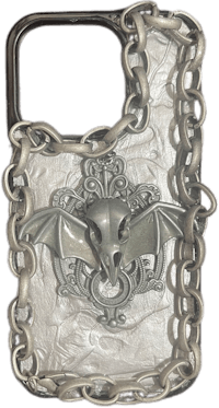 a silver phone case with a bat on it